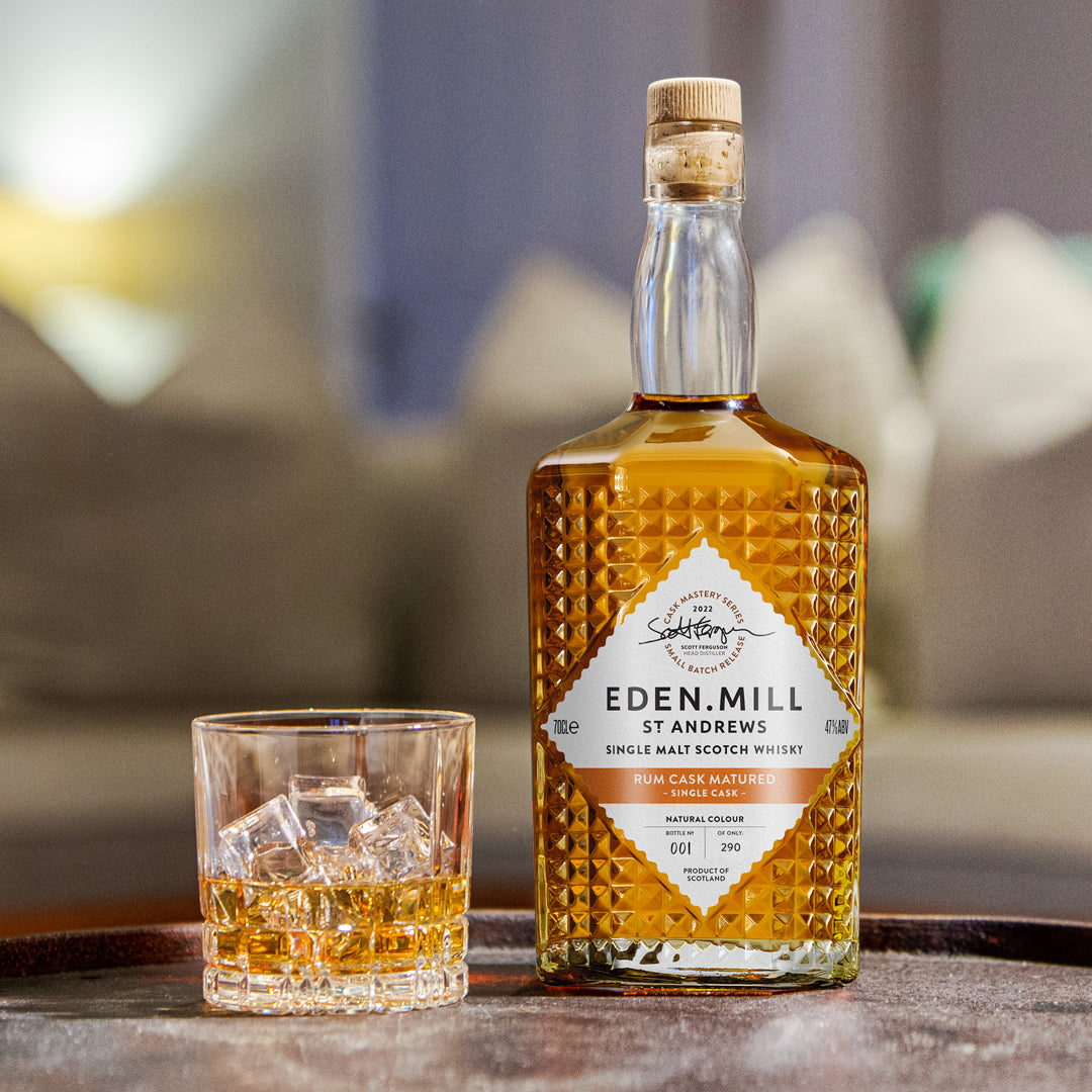 Rum Cask Single Malt Whisky Bottle on table with whisky glass