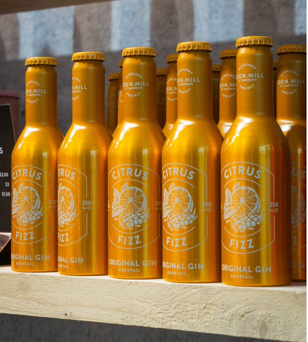 Shelf of Yellow Citrus Fizz Cocktail Bottles