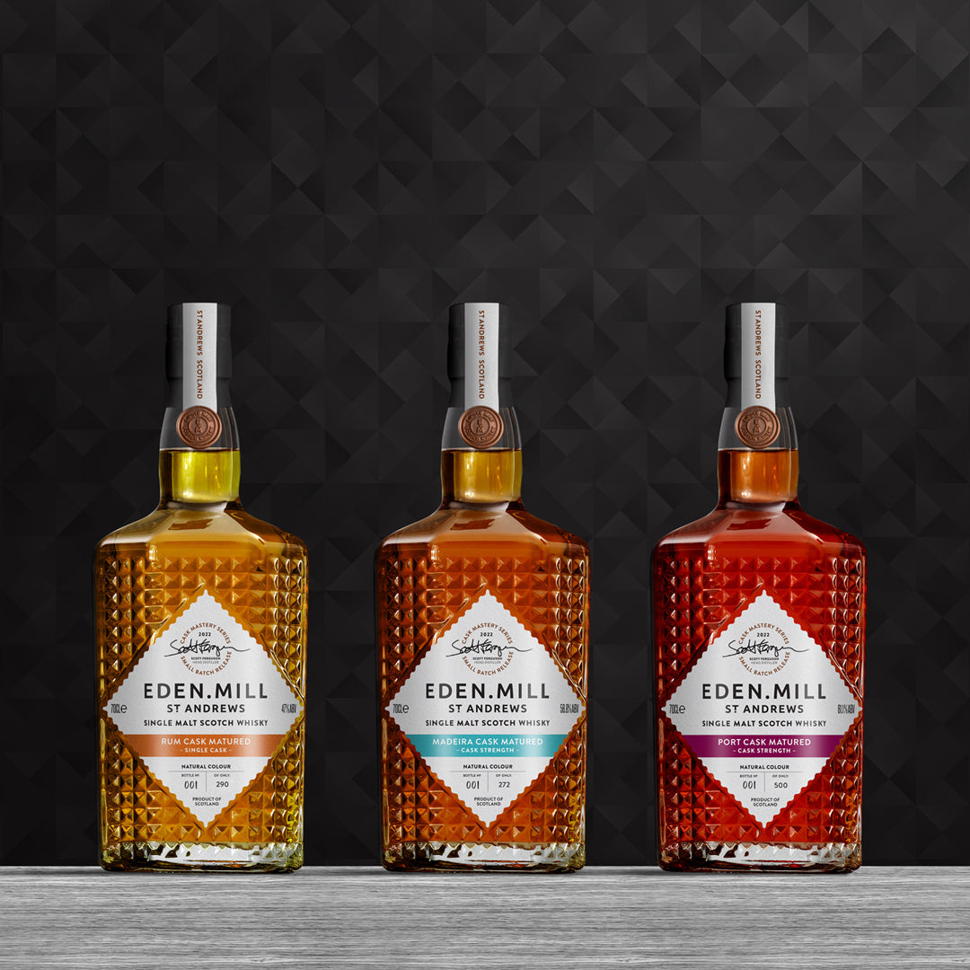 Cask Mastery Single Malt Whisky Bottle Collection on black abstract background