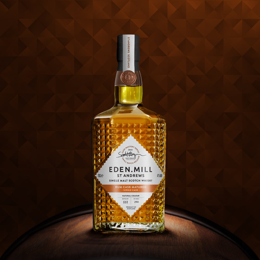 Rum Cask Single Malt Whisky Bottle on gold abstract background
